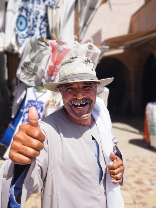 Friendly smiling Market stall Trader in Egypt