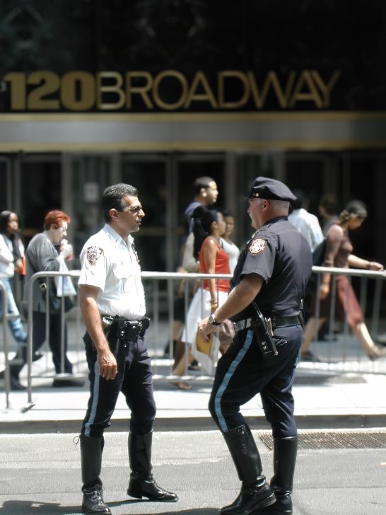 Members of New York Police Department maintaining law and order outside a Broadway department store