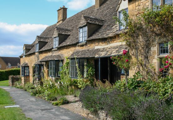 Honey coloured stone cottages on the High Street in Broadway Worcestershire