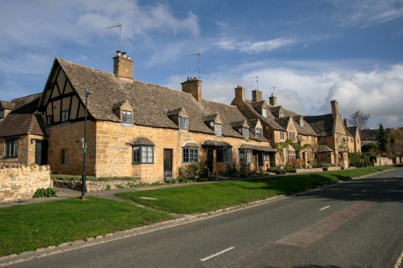 Honey coloured stone cottages on the High Street in Broadway Worcestershire