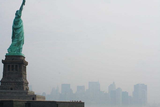 Statue of Liberty with a New York city backdrop in the haze