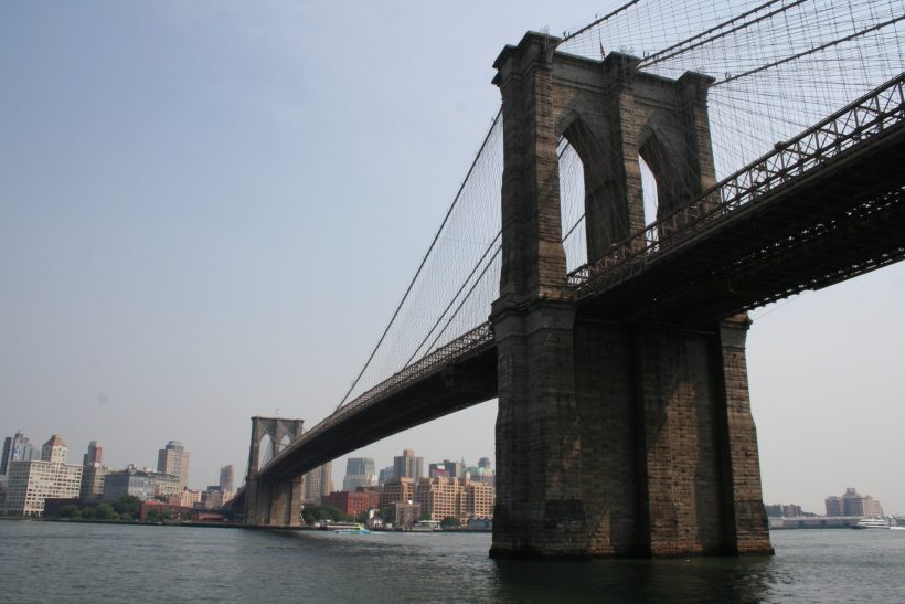Brooklyn Bridge crossing the East River in New York City.