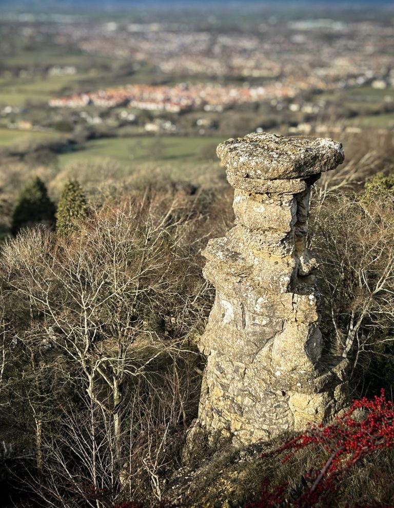 Devils Chimney, Lechampton, Cheltenham Photo of Devils Chimney in Gloucestershire overlooking the town of Cheltenham bathed in golden evening sunshine